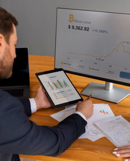 business-person-looking-finance-graphs-scaled business-person-looking-finance-graphs-scaled