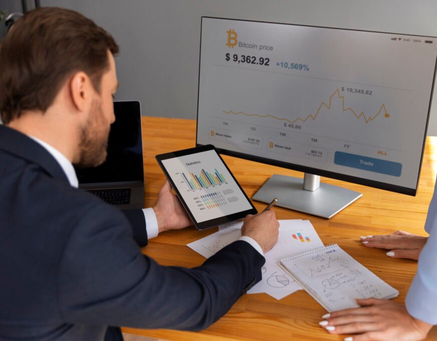 business-person-looking-finance-graphs-scaled business-person-looking-finance-graphs-scaled